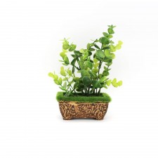 Mini plante artificielle verte dans un pot rectangulaire en plastique
